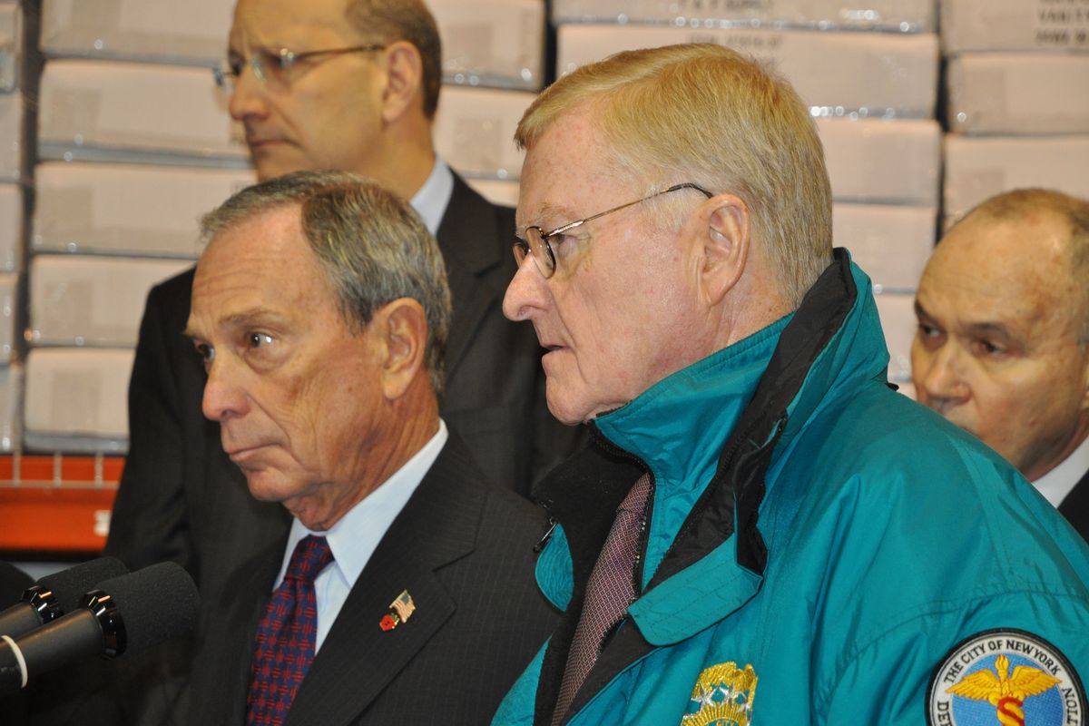 New York Mayor Michael Bloomberg, left, and Sanitation Commissioner John Doherty discuss the city’s snow removal efforts Wednesday.