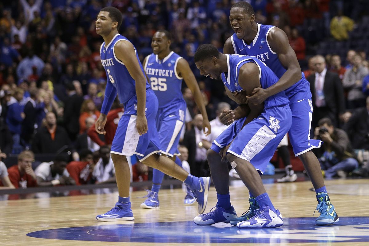 Kentucky players celebrate their semifinal victory in the Midwest Regional semifinal against in-state rival Louisville. (Associated Press)