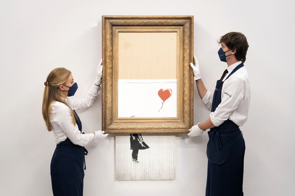 In this Sept. 3, 2021 photo, art handlers at Sotheby
