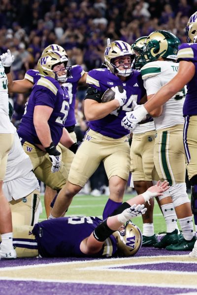 Washington Husky sophomore tight end Kade Eldridge celebrates a touchdown on Aug. 30 in Seattle.  (Jennifer Buchanan/Seattle Times)