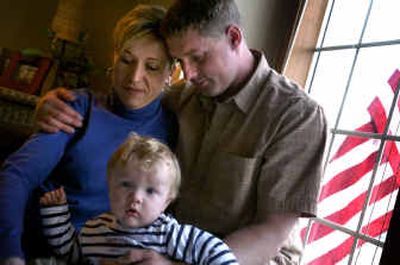 
Jim DeWitt is happy to be back home with his wife, Carri, and their, son Jack, almost 1 year old, after almost a year serving in Iraq as a broadcast journalist. 
 (Jed Conklin / The Spokesman-Review)
