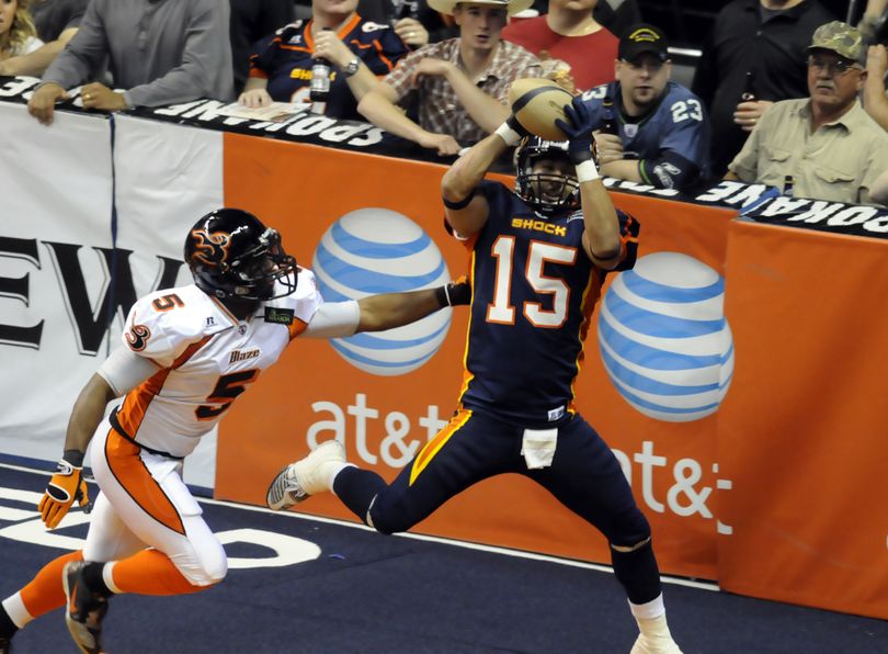 Spokane Shock's Raul Vijil yanks down one of his several receiving touchdowns over Utah's Tour'e Carter Saturday, May 22, 2010 at the Spokane Arena. (Jesse Tinsley / The Spokesman-Review)