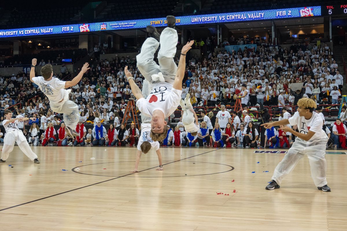 Central Valley students perform their “Welcome to Shoe York” dance routine at Thursday’s “Stinky Sneaker” games between CV and University at the Arena.  (Colin Mulvany/The Spokesman-Review)