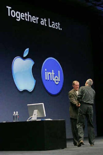 Apple Computer Inc. CEO Steve Jobs, right, shake hands with Intel Corp. CEO Paul Otellini, left, at Apple's Worldwide Developers Conference in San Francisco on Monday. 
 (Associated Press / The Spokesman-Review)