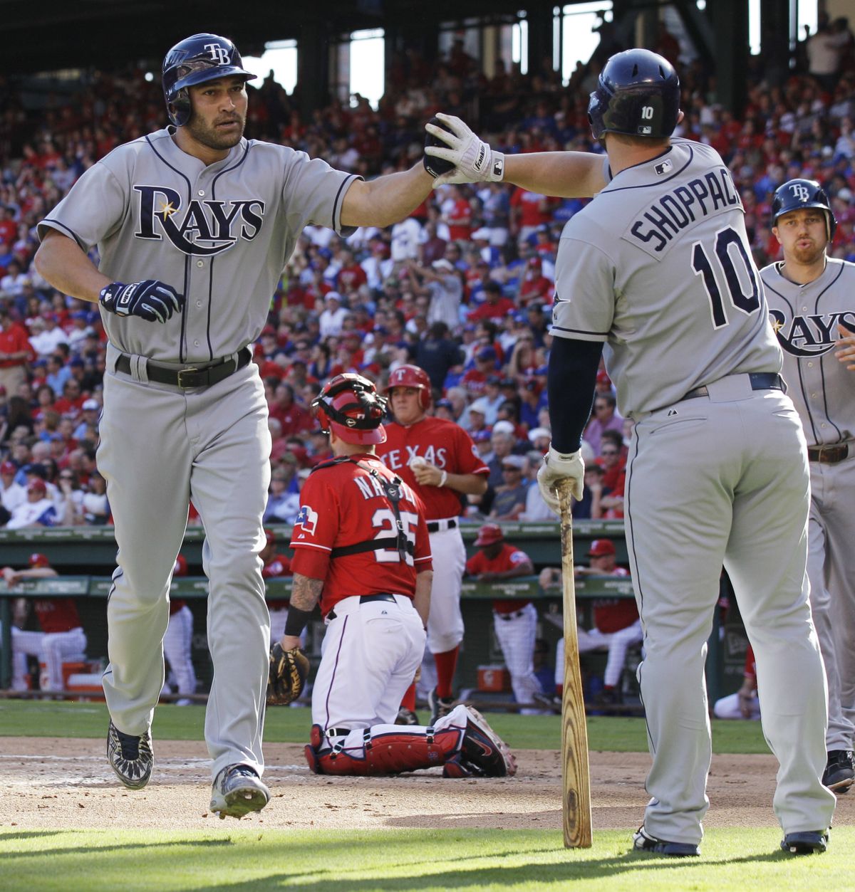 Rays catcher Kelly Shoppach, right, congratulates Johnny Damon on his two-run home run in the second inning. (Associated Press)