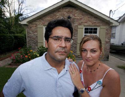 
Claudiney  and Adriana Pereira tried to buy this house in New Orleans. The high cost of insurance broke the deal. Now they plan to look for a house that's 30 percent cheaper, which will probably price them out of the neighborhood. 
 (Associated Press / The Spokesman-Review)