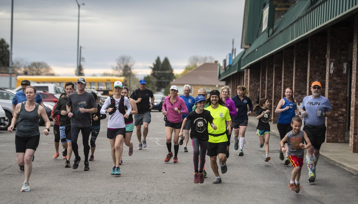 After meeting at the Monkey Bar in the Spokane Valley, members Spokane Valley Running Club (the Bisons) start their Bloomsday training run, Monday, April 22, 2019. (Colin Mulvany / The Spokesman-Review)
