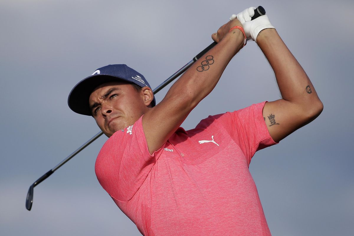 Rickie Fowler plays his shot from the 17th tee during the second round of the U.S. Open  Friday in Southampton, N.Y. (Seth Wenig / AP)