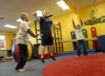 
Spokane Valley My Gym director Nels Radtke leads a Whiz Kids class in jumping jacks during a trial class offered this week at the new facility. 
 (J. BART RAYNIAK / The Spokesman-Review)