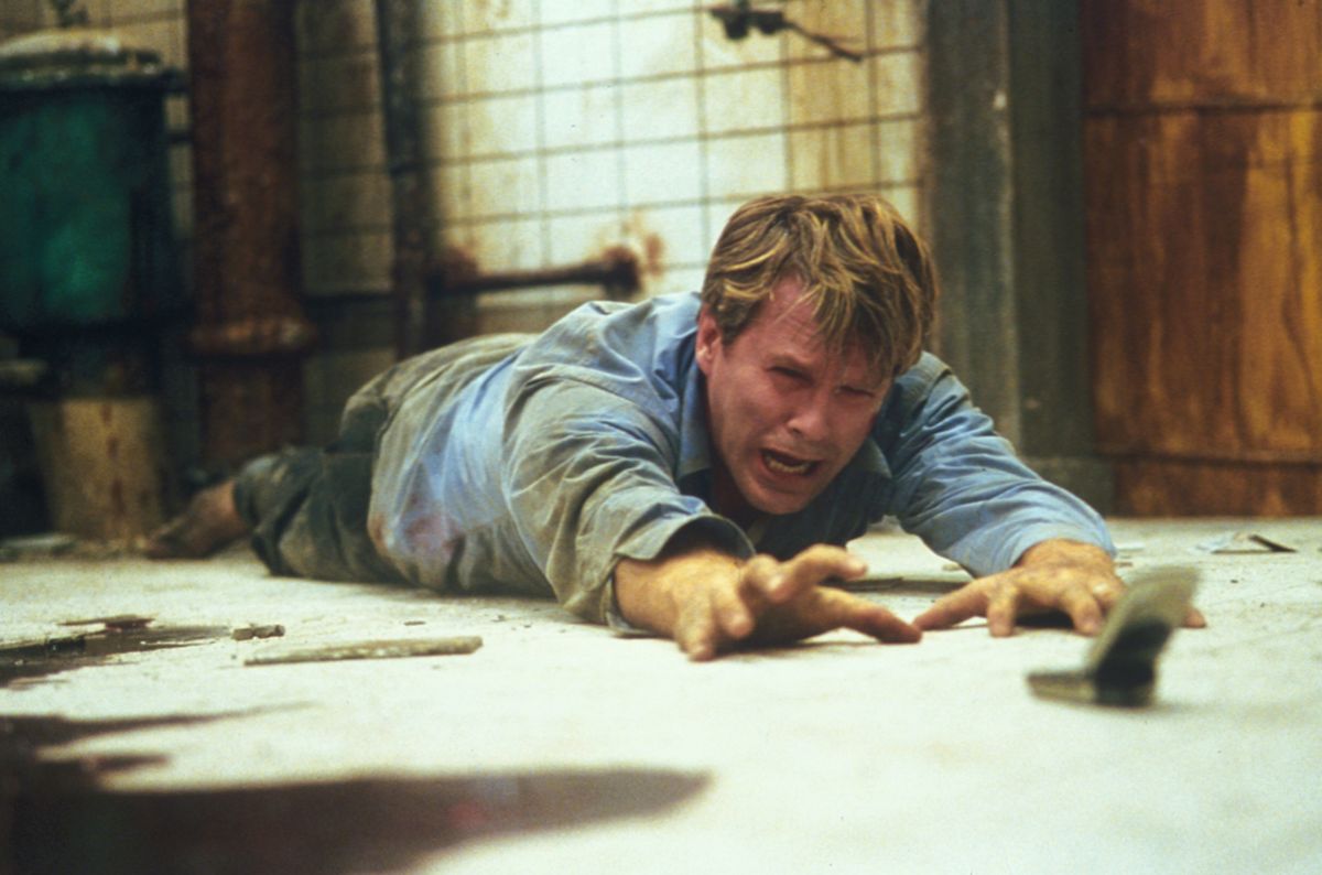 Cary Elwes finds himself chained to a rusty pipe inside a decrepit subterranean chamber in “Saw.” (Associated Press / The Spokesman-Review)