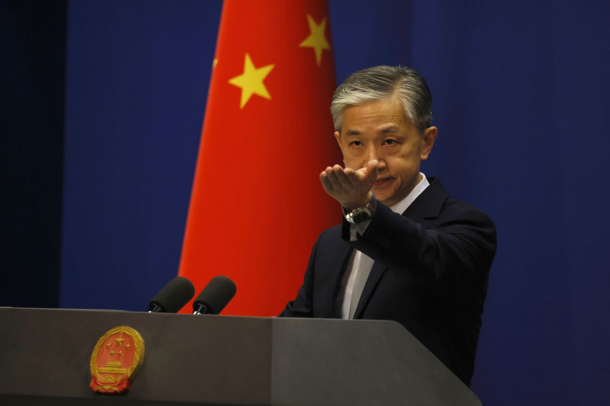 Foreign Ministry spokesperson Wang Wenbin gestures for questions during the daily briefing in Beijing on Thursday, July 23, 2020. China said "malicious slander" is behind an order by the U.S. government to close its consulate in Houston, Texas, and maintained Thursday that its officials have never operated outside ordinary diplomatic norms. (Ng Han Guan)