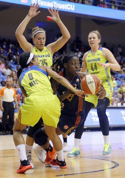 Connecticut’s Chiney Ogwumike looks to pass the ball in traffic. (Tony Gutierrez / Associated Press)