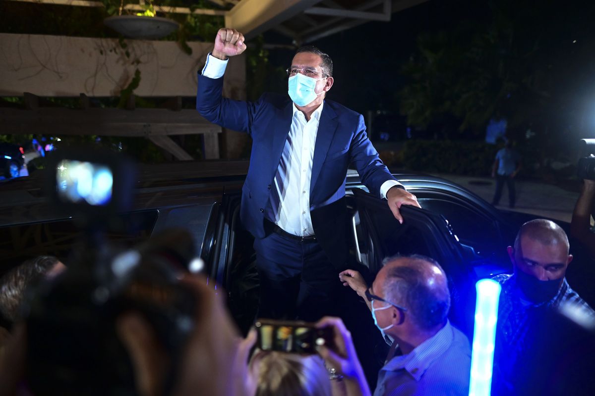 Pedro Pierluisi, gubernatorial candidate with the New Progressive Party (PNP), arrives at Vivo Beach Club to celebrate a slim lead of the pro-statehood party in the Puerto Rican general elections, in Carolina, Puerto Rico, Tuesday, Nov. 3, 2020. Pierluisi briefly served as governor following last year