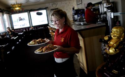 “With the price of gas these days I think it’s really needed,” says Marcie Black, a server at  Golden Dragon restaurant in Post Falls, of the new minimum wage.   (Kathy Plonka / The Spokesman-Review)
