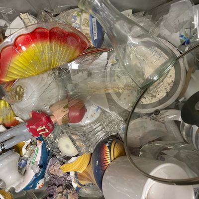 Broken glass and other donations at Goodwill Northern New England, in Westbrook, Maine, are shown in this image provided by the nonprofit.   (Associated Press)