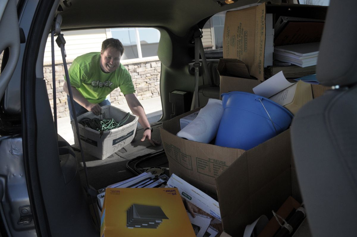 Paul Simmons, Cheney Parks and Recreation Director, unloads a van full of office supplies Monday. The department had to move into temporary offices at the Tomlinson Black building after their building was damaged during the winter.  (Photos by CHRISTOPHER ANDERSON / The Spokesman-Review)
