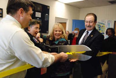 
City Administrator Ted Danek, Spokane Police Chief Anne Kirkpatrick, Teri McKenzie, the vice president student and instruction services at SCC, and SCC President Joe Dunlap cut the ribbon at Mission COPS, the 13th COPS Shop in Spokane.
 (Erin Daniels-Bangle / The Spokesman-Review)
