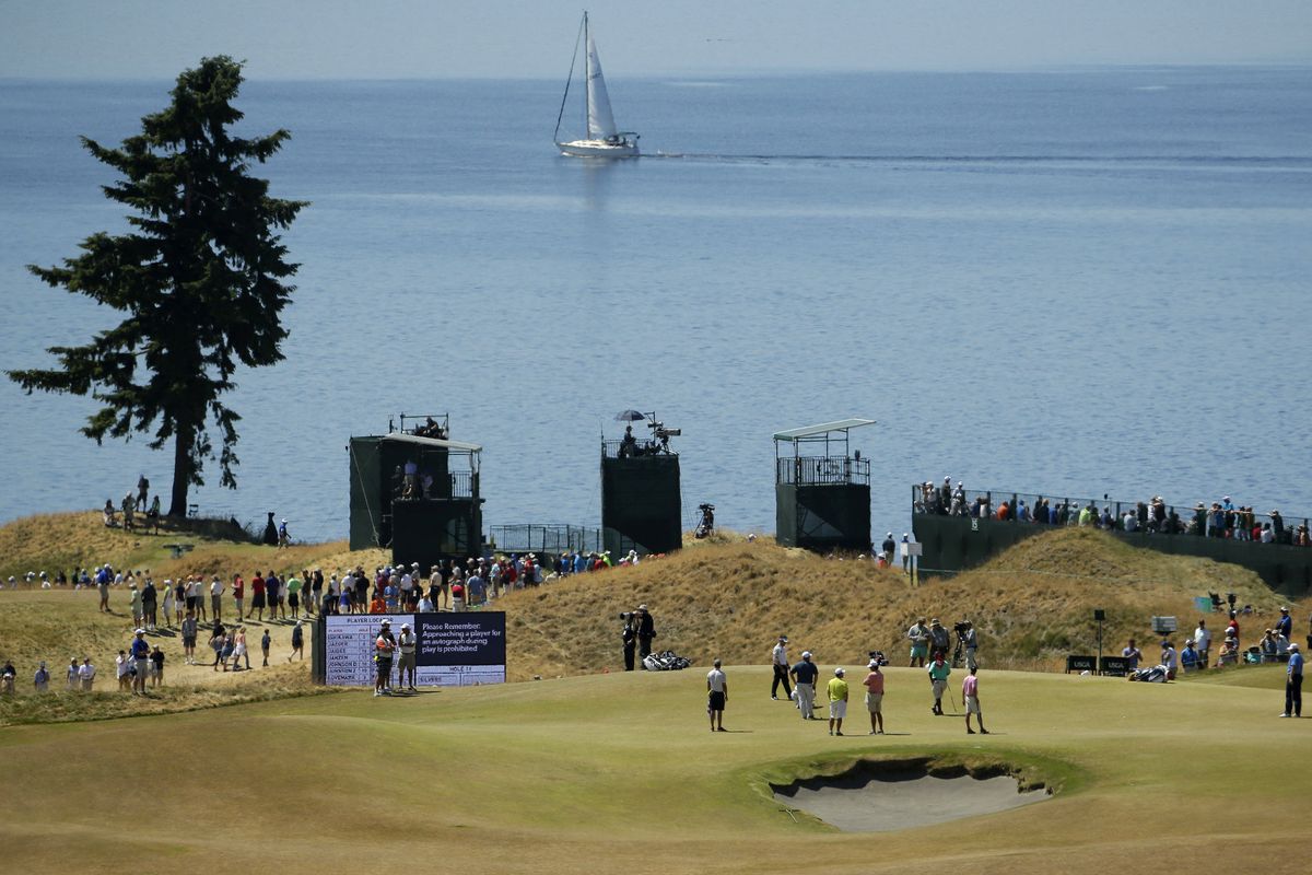 After an unseasonably warm and dry spring in the Pacific Northwest, the grass around Chambers Bay now has a heavy shade of tan. (Associated Press)