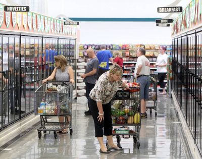 Shoppers browse the frozen food cases. The first day of each month is typically one of the busiest times to visit a WinCo in Idaho. That’s when the state issues food-stamp benefits. (Idaho Statesman)