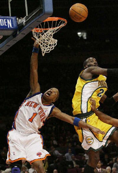 
Seattle's Johan Petro blocks a shot by New York's Steve Francis on Tuesday. 
 (Associated Press / The Spokesman-Review)