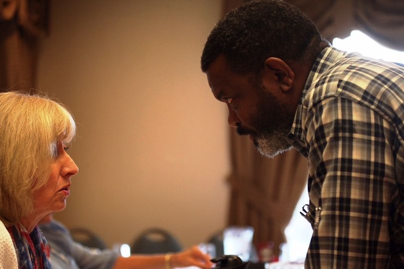 Alex Barron, the Kootenai County GOP Central Committee secretary and Bard of the American Redoubt, engages in an intense discussion with state Sen. Mary Souza, R-Coeur d'Alene. (Duane Rasmussen file photo)