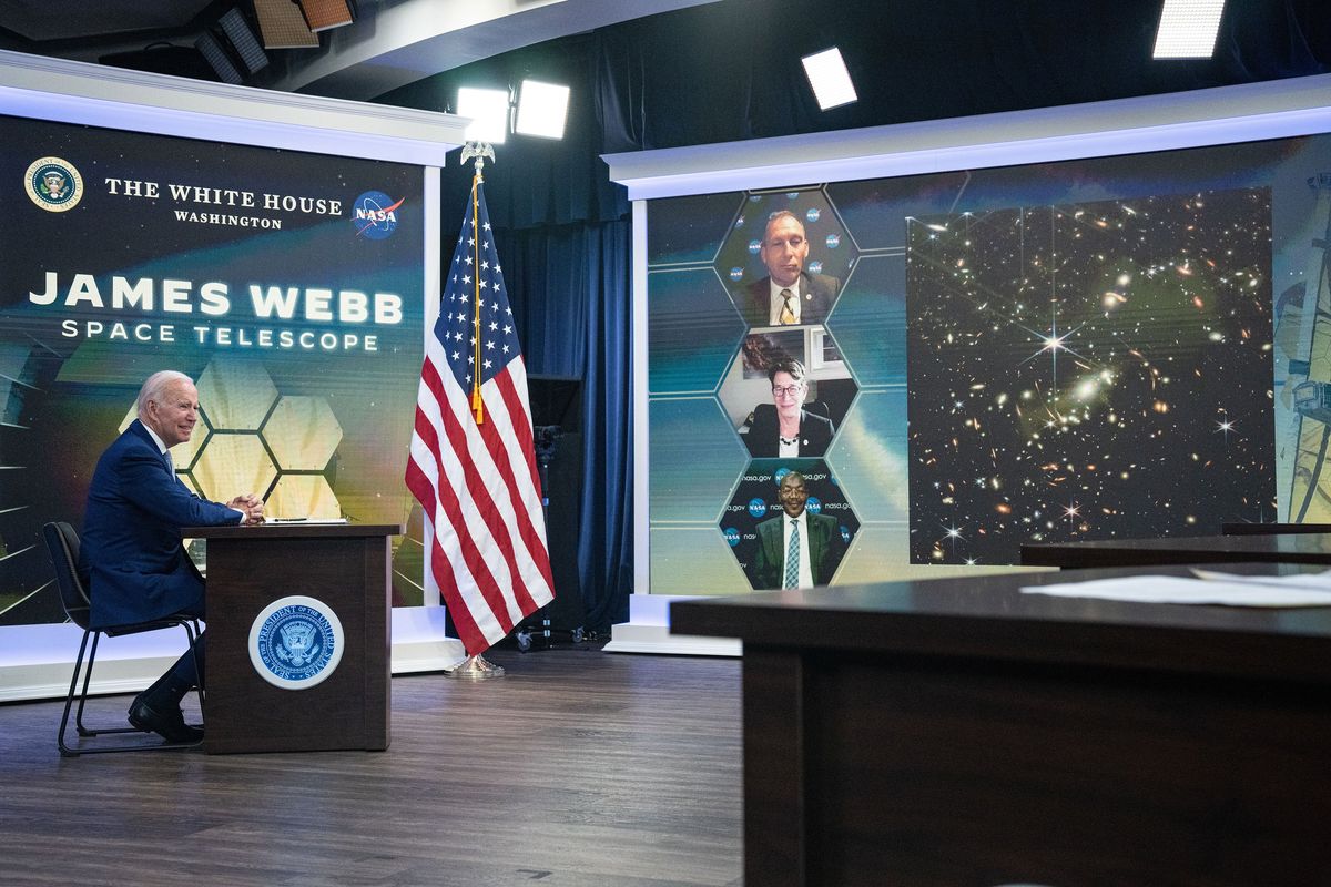 President Joe Biden listens during a briefing from NASA officials about the first images from the James Webb Space Telescope, the largest space telescope ever built, in the South Court Auditorium on the White House complex, in Washington, Monday, July 11, 2022. On Monday, humanity got its first glimpse of what the observatory in space has been seeing: a cluster of early galaxies.  (HAIYUN JIANG/New York Times)