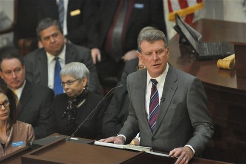 Idaho Gov. Butch Otter gives his State of the State address to a joint session of the Idaho Legislature on Monday. (AP Photo / Charlie Litchfield)