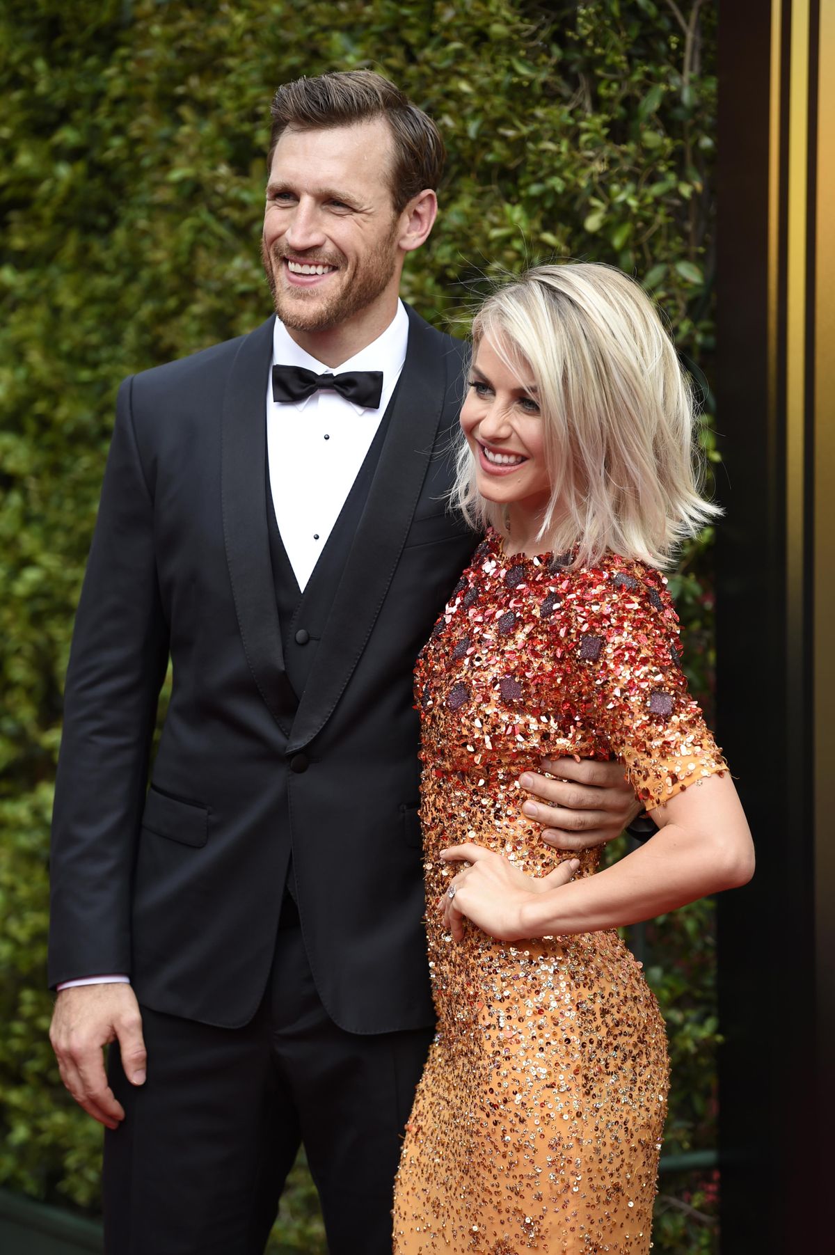 Brooks Laich, left, and Julianne Hough arrive at the Creative Arts Emmy Awards at the Microsoft Theater in Los Angeles in this file photo from Sept. 12, 2015. (Chris Pizzello / Chris Pizzello/Invision/AP)