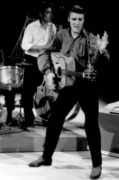 Elvis Presley performs on 