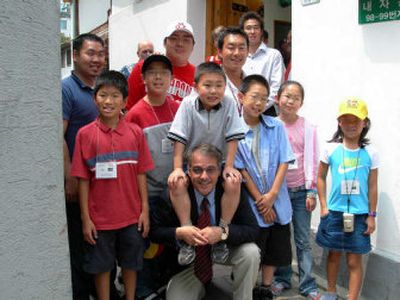 
Lt. Gov. Brad Owen kneels in front with American children adopted from Korea, including his sons Adam Owen, upper left, and Mark Owen, standing in back third from left, on a visit to Seoul, South Korea, on July 7. 
 (Photo courtesy of the Owen family / The Spokesman-Review)