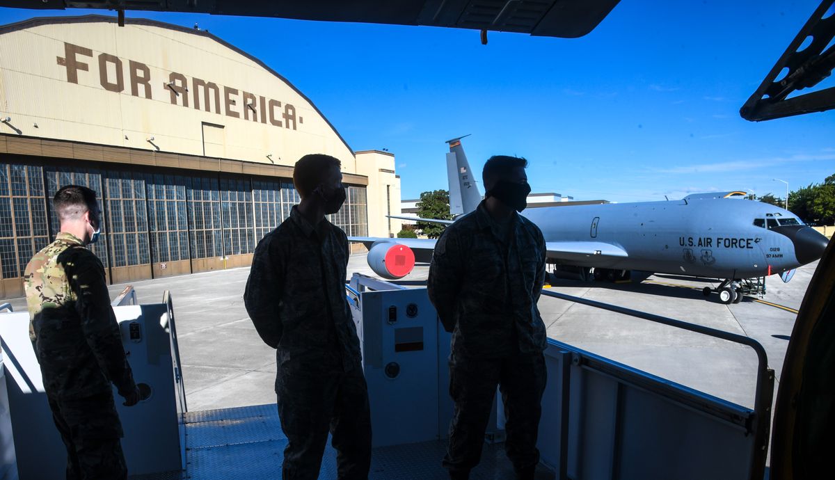TSgt. Eric Stevenson, crew chief, left, along with jet engine mechanics A1C Aaron Pyle, center, and Elijah Gawthorp, wait to give a tour celebrating the 64th birthday of KC-135R tankers, Monday, Aug 31, 2020 at Fairchild Air Force Base.  (Dan Pelle/The Spokesman-Review)