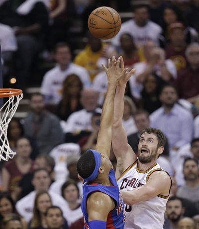 Cleveland Cavaliers' Kevin Love, right, shoots over Detroit Pistons' Tobias Harris in the first half in Game 2 of a first-round NBA basketball playoff series. (Tony Dejak / Associated Press)