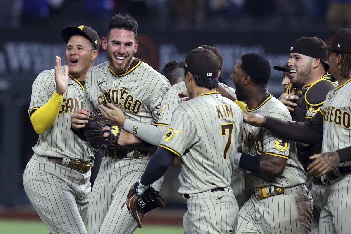 San Diego Padres starting pitcher Joe Musgrove, second from left, is mobbed by teammates after pitching a no-hitter against the Texas Rangers in a baseball game Friday, April 9, 2021, in Arlington, Texas.  (Associated Press)