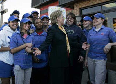 
Hillary Rodham Clinton chats with workers at a Dairy Queen while posing for pictures in South Bend, Ind., on Sunday. Associated Press
 (Associated Press / The Spokesman-Review)