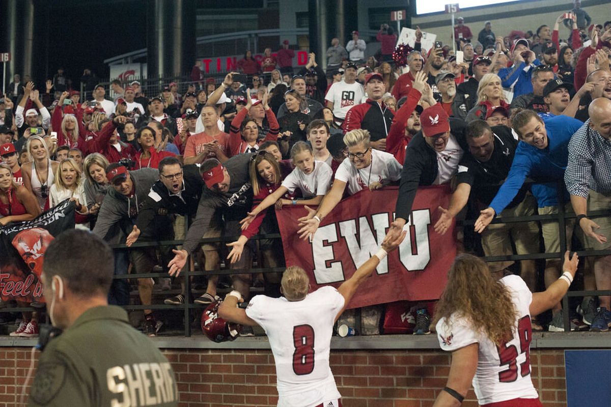 Eastern Washington Eagles quarterback Gage Gubrud (8) grabs high fives from cheering fans after defeating WSU during the second half of a college football game on Saturday, Sep 3, 2016, at Martin Stadium in Pullman, Wash. EWU won the game 45-42.  (TYLER TJOMSLAND/The Spokesman-Review)