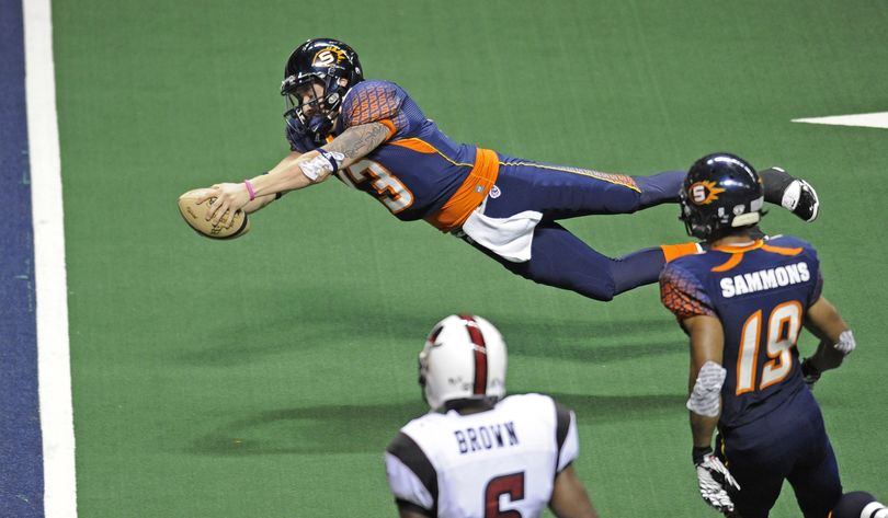 Spokane Shock quarterback Bill Stull dives for the endzone and scores against Dallas, Saturday, May 14, 2011, in the Spokane Arena.   Stull was injured on the play. (Christopher Anderson / The Spokesman-Review)