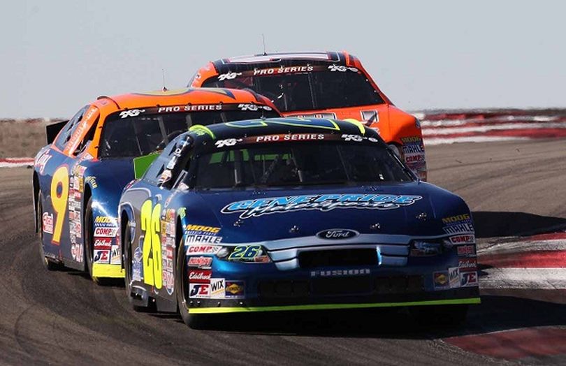 Greg Pursley (26) leads Patrick Long (9) and David Mayhew (17) early in the race. (Photo courtesy of Jonathan Ferrey/Getty Images for NASCAR) (Jonathan Ferrey)