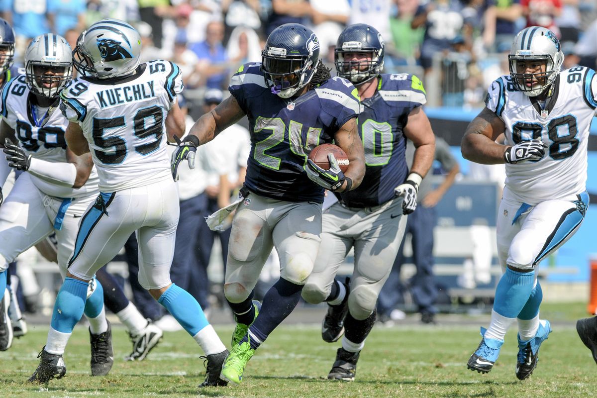 Marshawn Lynch and the Seahawks’ O-line struggled against Carolina. (Associated Press)