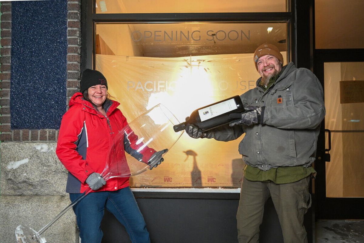 Entrepreneurs Amber Park, left, and John Park, right, ham it up Wednesday outside the historic storefront at 1020 S. Perry St. in the Perry district where they plan to open a new wine bar, called Pacific to Palouse.  (Jesse Tinsley / The Spokesman-Review)