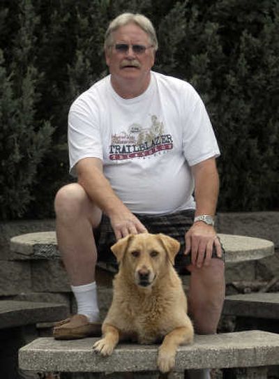
David Perry, shown with his dog Libby, has organized all 25 Founder's Day Trailblazer Triathlon in Medical Lake. 
 (J. BART RAYNIAK / The Spokesman-Review)