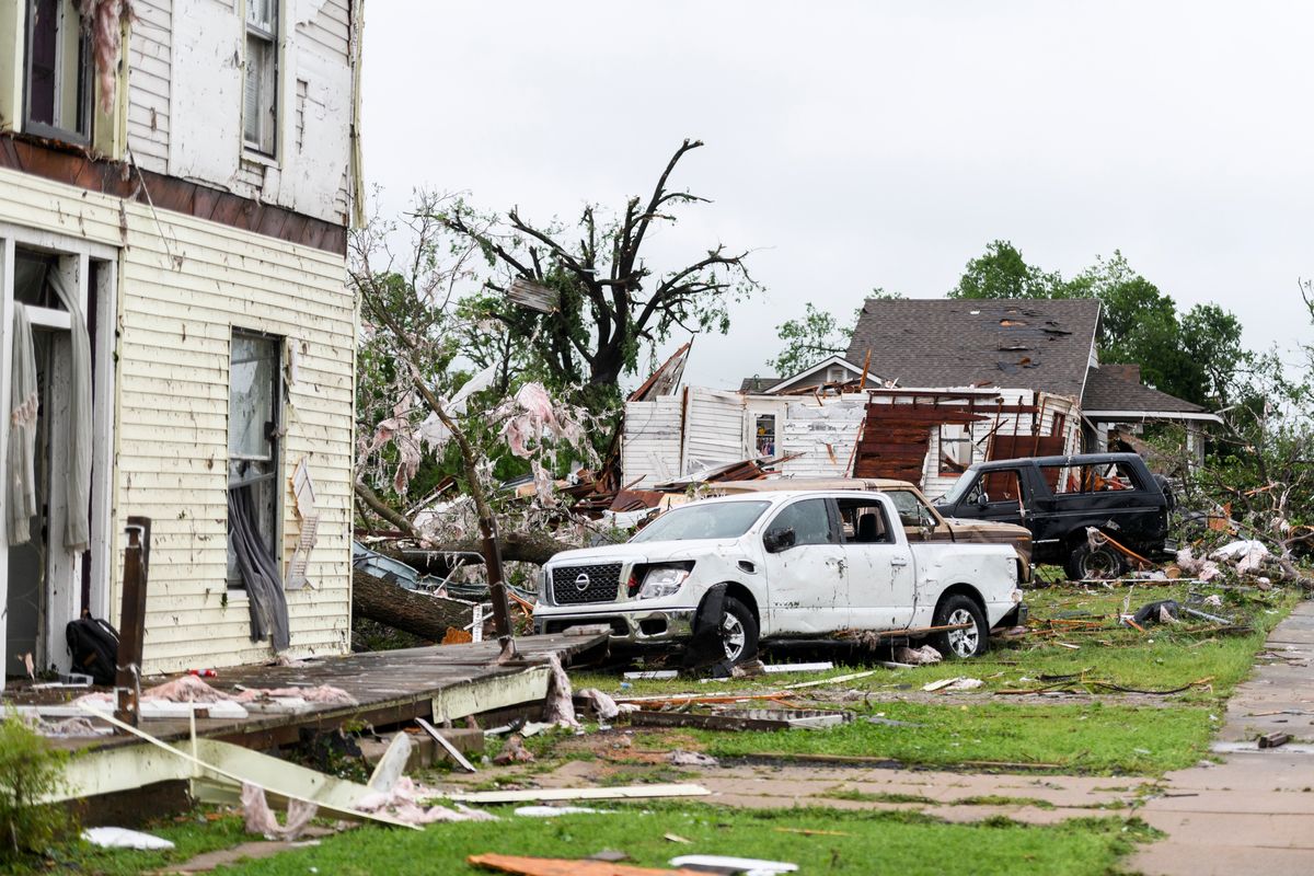 Top: Damage in the town of Sulphur, Okla., on Sunday after a series of severe storms and tornadoes swept through the area. Above: Sierra Fox, left, Kyle Wilcox and Kayla Wilcox begin recovery work on Kevin and Tracey Fox’s house in Minden, Iowa, on Saturday.  (MICHAEL NOBLE JR.)