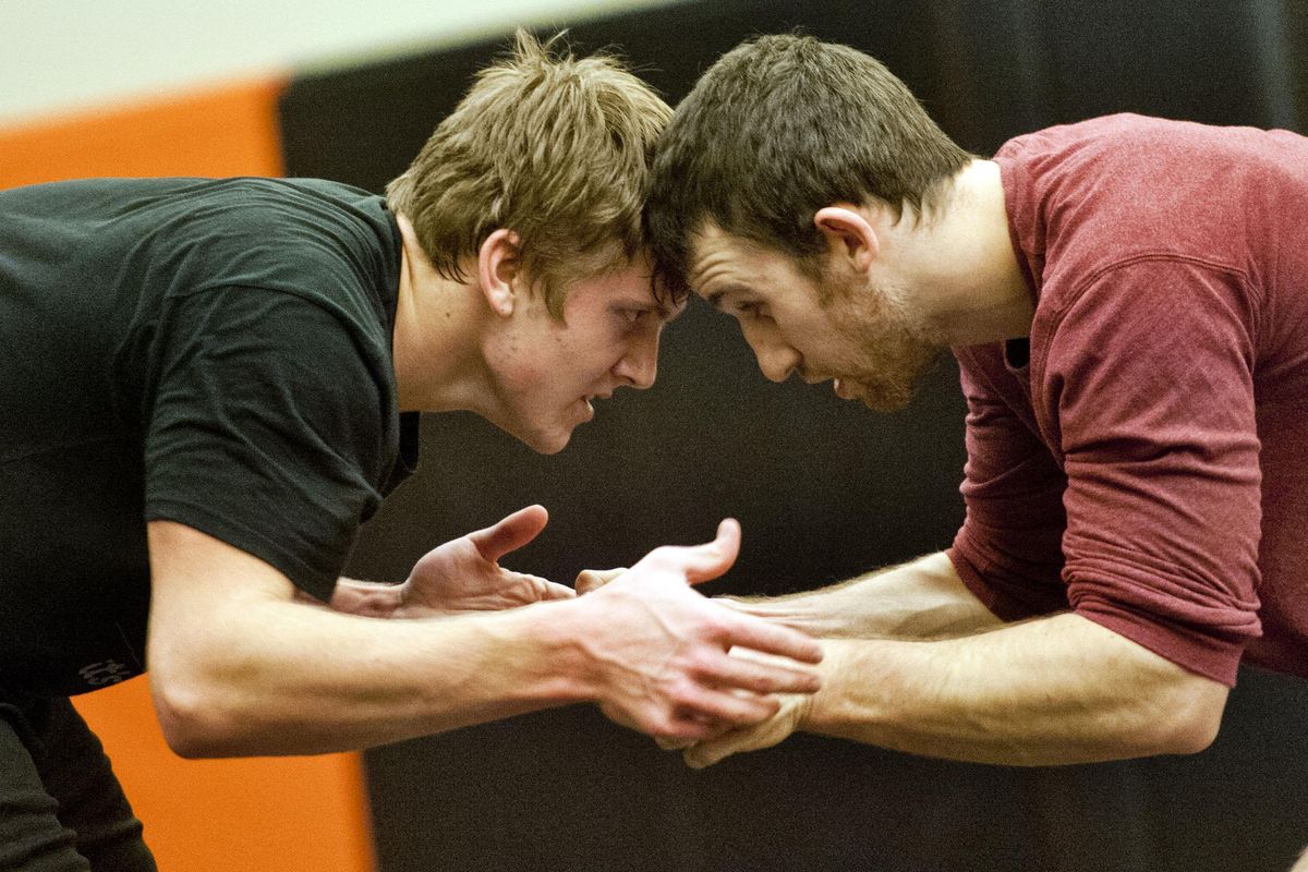 West Valley’s Ethan Simpson, left, wrestles with assistant volunteer coach Jacob Harkness during practice on Tuesday, Nov. 28, 2017. (Kathy Plonka / The Spokesman-Review)