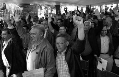 
Members of the Venezuelan National Assembly vote  to give  President Hugo Chavez wide-ranging lawmaking authority  in a special session at Plaza Bolivar in Caracas on Wednesday. 
 (Associated Press / The Spokesman-Review)