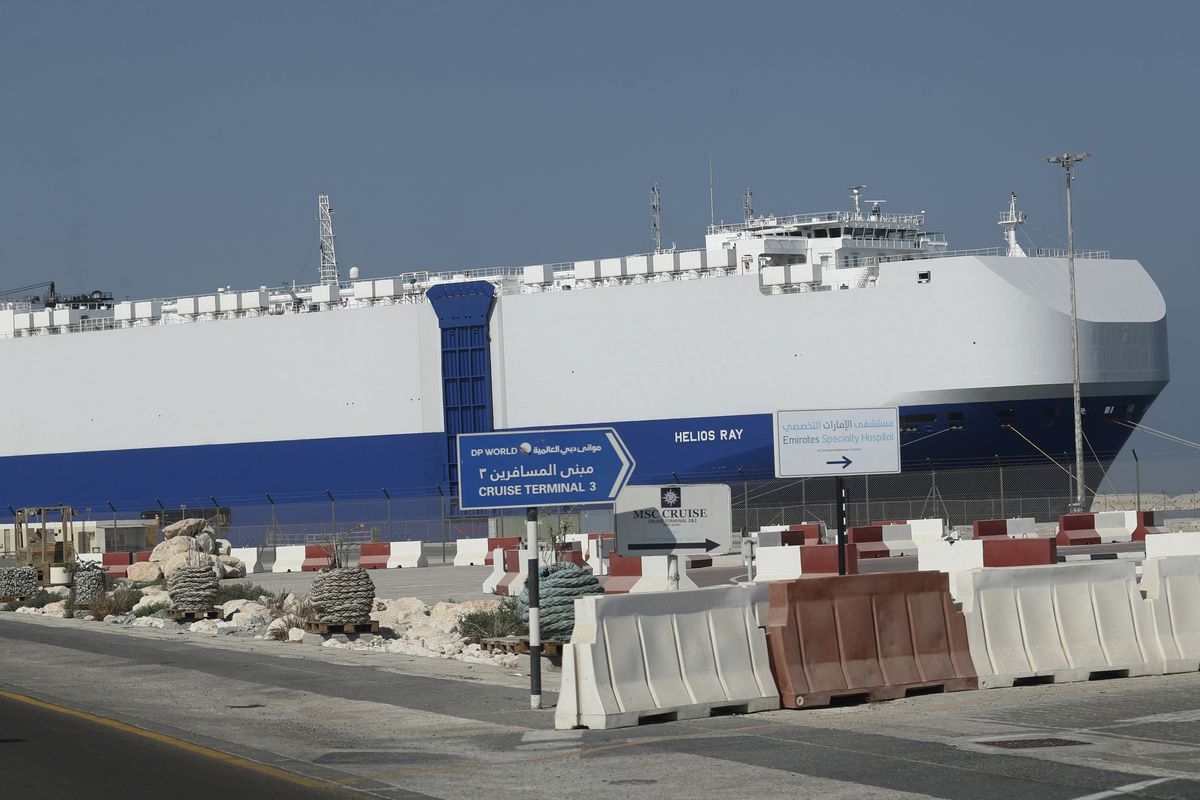 The Israeli-owned cargo ship, Helios Ray, sits docked in port after arriving earlier in Dubai, United Arab Emirates, Sunday, Feb. 28, 2021. The ship has been damaged by an unexplained blast at the gulf of Oman on Thursday.  (Kamran Jebreili)