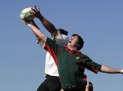 
Charlie Ray, right, of the Bozeman Cutthroat leaps to get the ball away from Mark Nissley of the North Idaho Osprey during a match Saturday at the Kootenai Cup, a rugby tournament put on by North Idaho Men's Rugby at Hayden Meadows Elementary, Hayden. 
 (Jesse Tinsley / The Spokesman-Review)