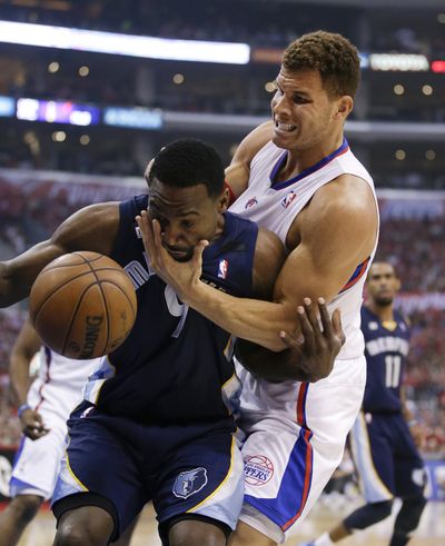 Clippers’ Blake Griffin, right, had his hands full battling Tony Allen for loose basketball. (Associated Press)