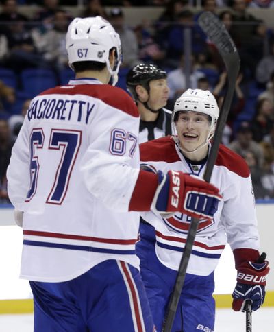 Montreal Canadiens' Brendan Gallagher, right, celebrates his second goal of the third period with teammate Max Pacioretty. (Associated Press)