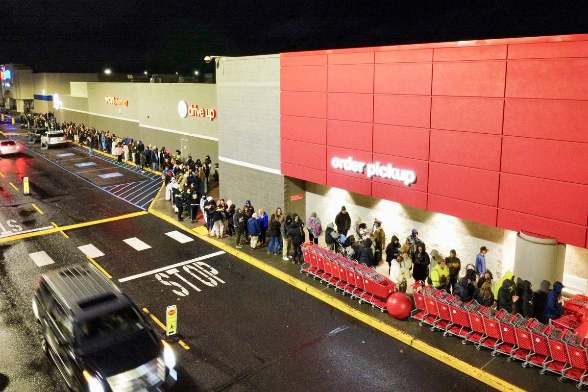 Hundreds line up for the 6 a.m. opening of the Target Store on Friday at Northpointe Plaza in north Spokane. The first 100 in line received a gift bag with small gift items like candy or lip gloss with the chance of receiving one of the 10 $100 gift certificates.  (Jesse Tinsley/THE SPOKESMAN-REVIEW)