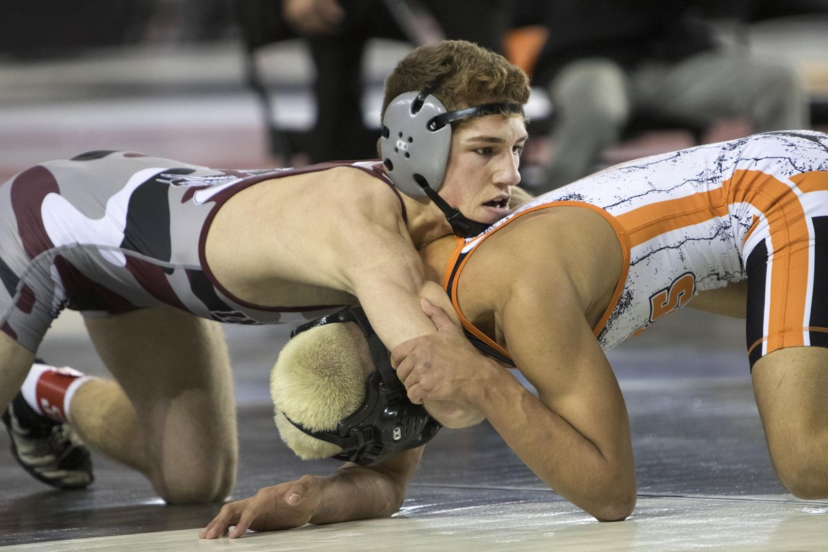 Colville’s Trent Baun controls Zillah’s Joel Coronel from the top in their 126-pound State 1A championship match last Saturday  in Tacoma. (Patrick Hagerty / For The S-R)