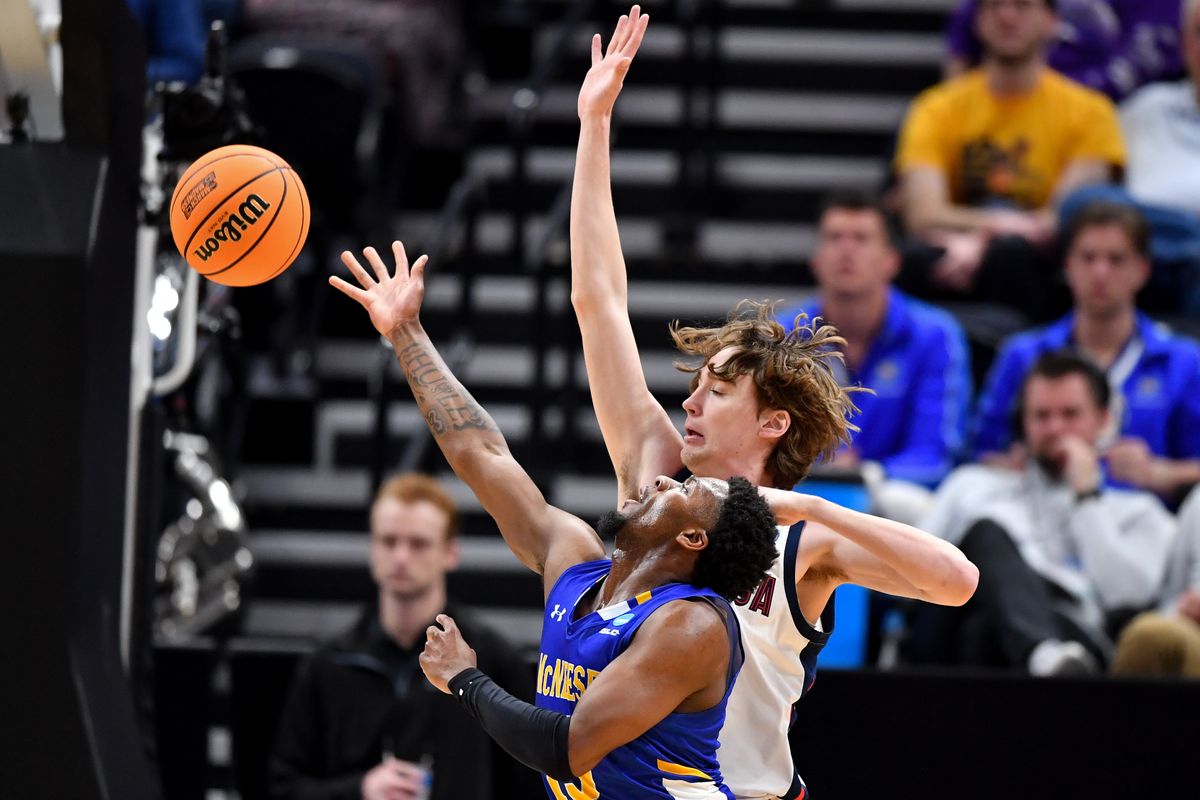 Gonzaga guard Dusty Stromer plays tight defense against McNeese State guard Shahada Wells during the second half of Thursday’s NCAA Tournament first-round game at the Delta Center in Salt Lake City.  (Tyler Tjomsland/The Spokesman-Review)